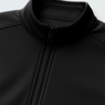 flat lay of a light gray softshell jacket on a clean white background. sleeves extended zippers visible minimal shadows top down view high clarity no logo. 1 768x960