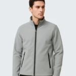 flat lay of a light gray softshell jacket on a clean white background. sleeves extended zippers visible minimal shadows top down view high clarity no logo. 5 819x1024